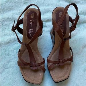 Leather upper and insole is suede with wood wedge.